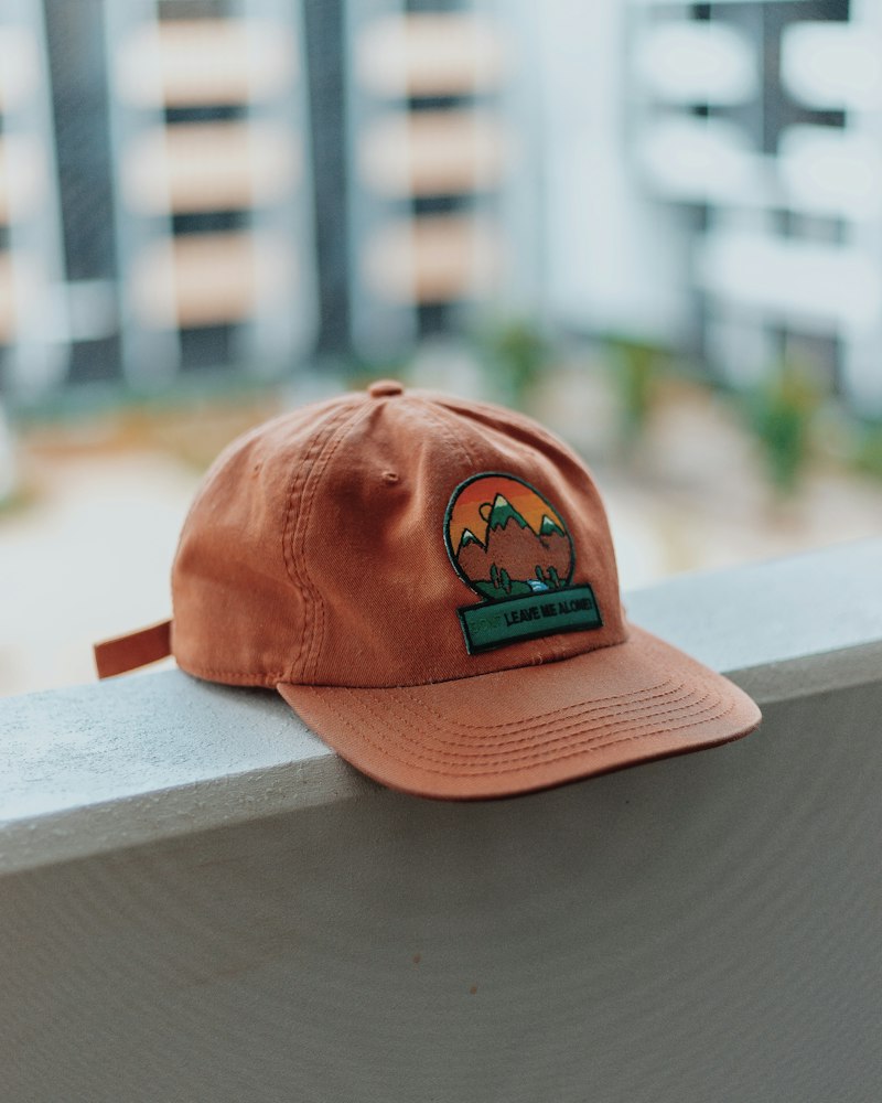 Cap with an embroidered mountain patch