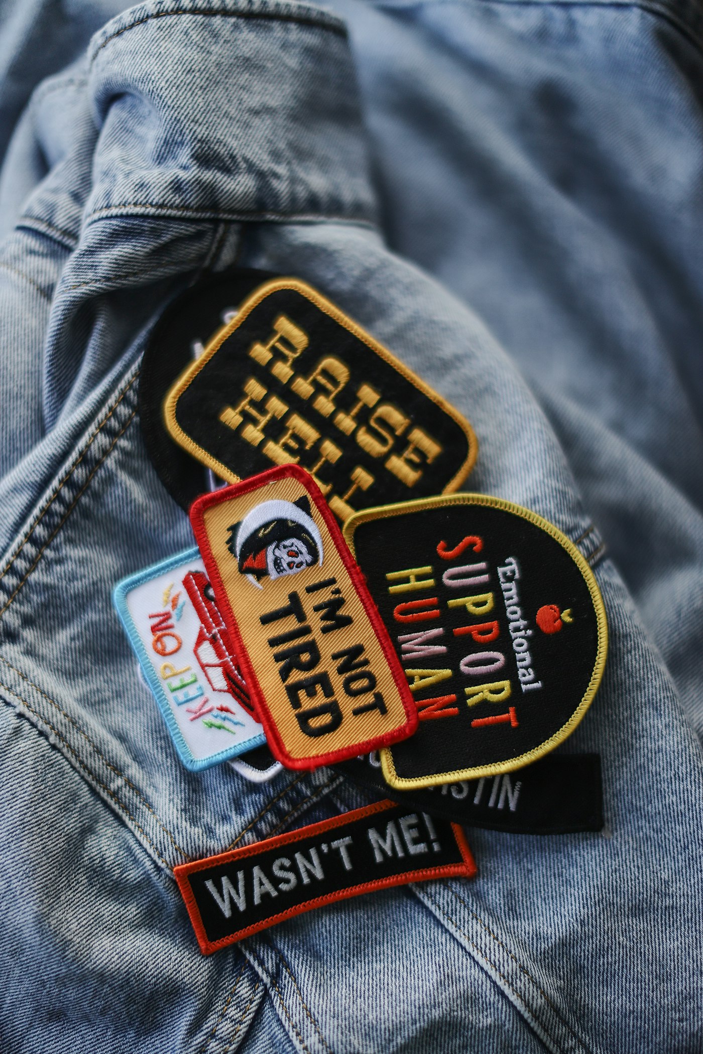 Denim jacket covered in embroidered patches