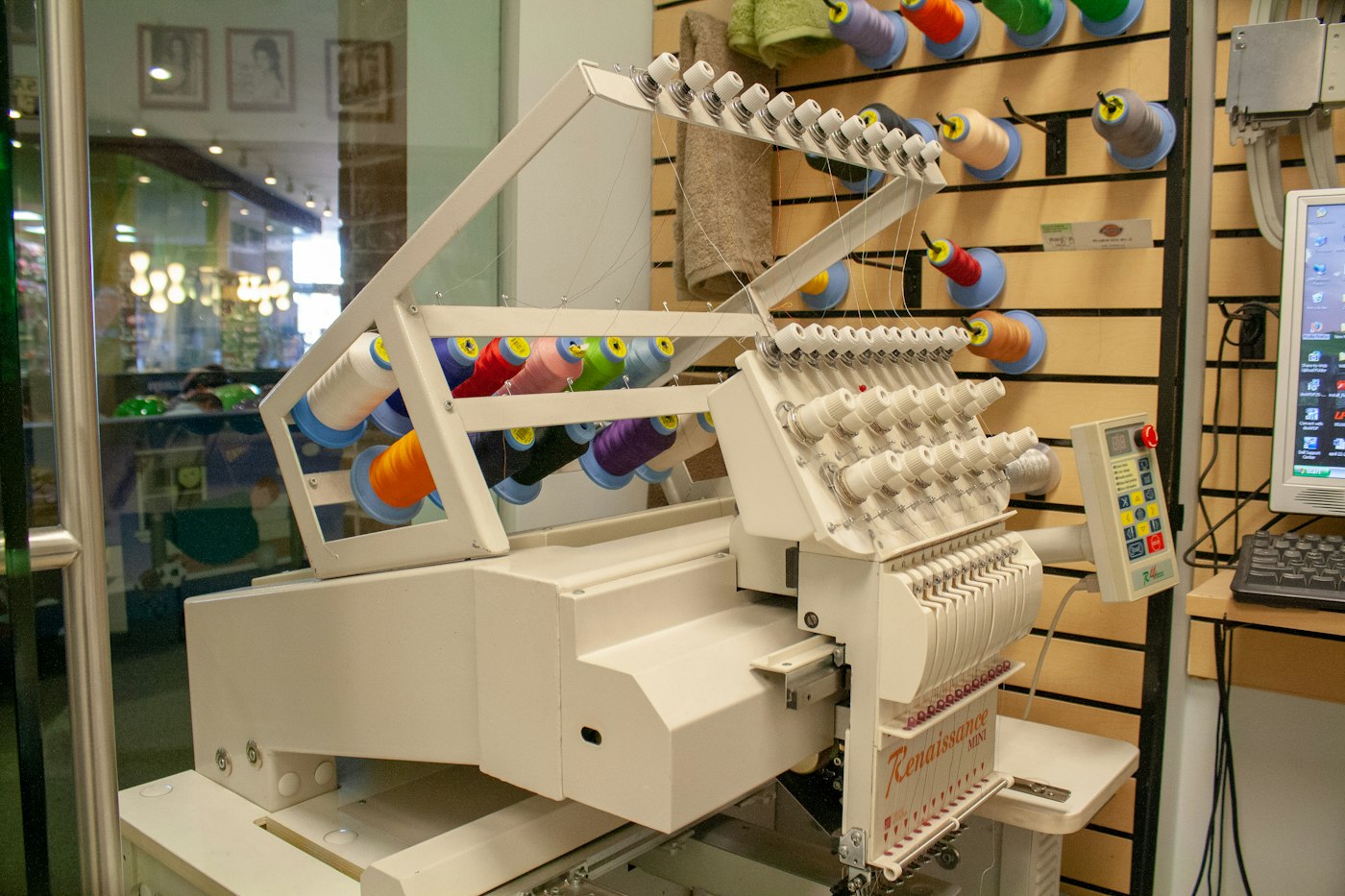 Multi-head embroidery machine in a workshop